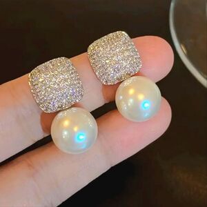 Delicate pearl stud earrings